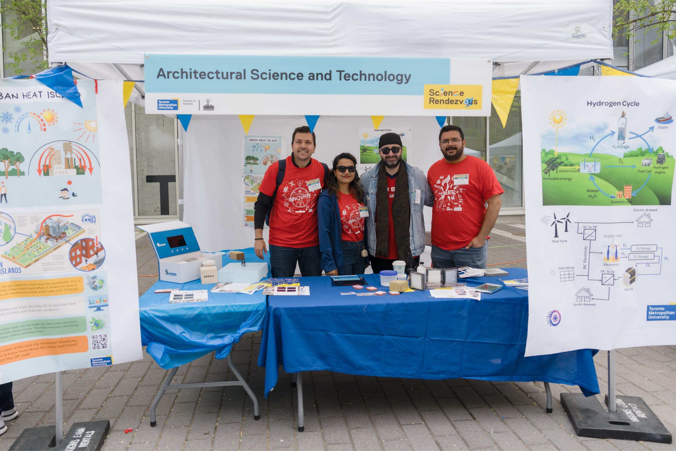 Volunteers posing at the Architectural Science and Technology Booth.